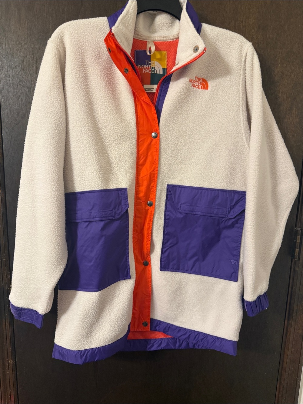 The North Face Ivory Sherpa Coat with Purple Pockets and Orange Placket